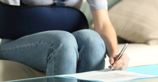 injured person signing a document