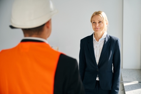 lawyer with client in hard hat
